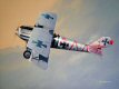  Fritz Höhn was a German Ace of World War One despite only scoring his first victory in the final month of 1917.  He is depicted here in his Pfalz D.III of Jasta 21s in the spring of 1918.  The red markings on this aircraft were intended to confuse the aim of enemies, but the teddy bear he carried behind the cockpit was just for luck.  He later flew a Fokker D.VII and in total claimed 11 enemy aircraft and 10 observation balloons, scoring his last victory on the 3rd of October 1918, the same day on which he himself was shot down and fatally wounded by a French aircraft.   