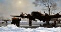 A Halifax bomber of Bomber Command is being refueled and checked by ground crew on a snow covered RAF airfield.  The Halifax was one of the three major bombers of the RAF.  The Royal Air Force Halifax had a crew of six to eight, a maximum speed of 28......
